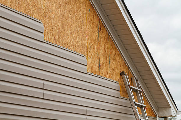 Professional Storm Damage Siding Repair technician working in Reinholds, PA